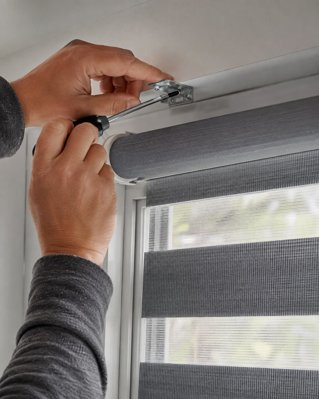 Installer fitting zebra blinds